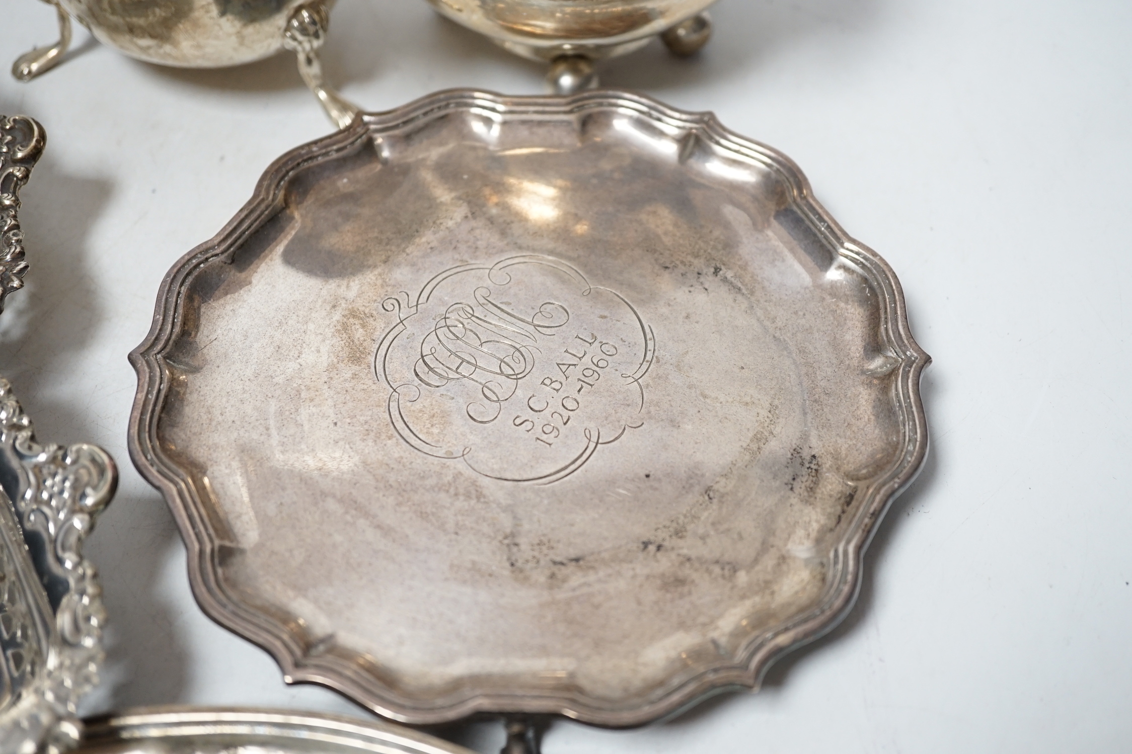 Sundry silver items including a Georgian cream jug, pair of later pierced bonbon dishes, Georgian teapot stand (a.f.), waiter, sauce boat and toastrack, 20.8oz.